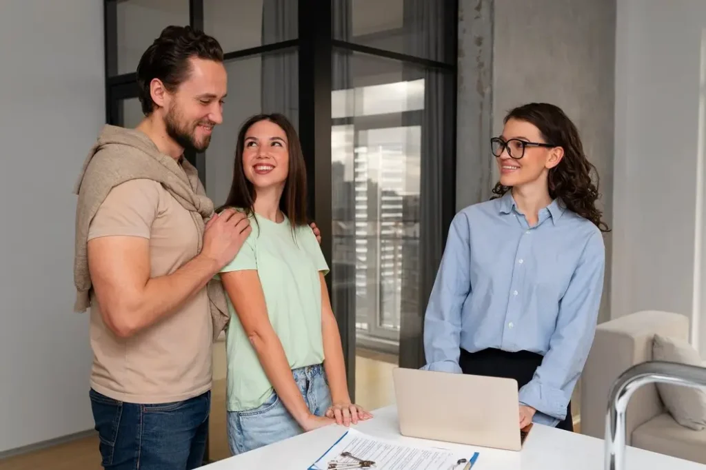 Couple discussing tenant rights with a lawyer in a modern office setting, emphasizing legal support for tenants in Bexar County.