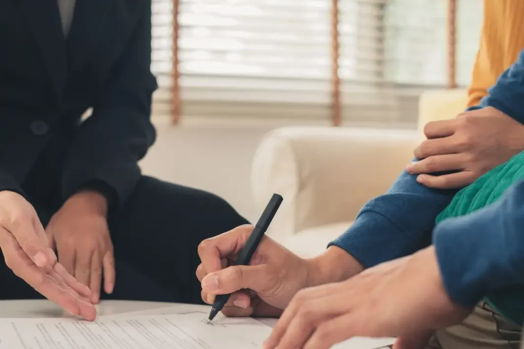Person signing a lease agreement with legal assistance, emphasizing landlord-tenant relations and compliance with Texas Property Code.
