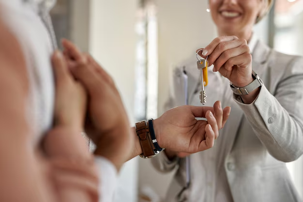 Woman handing over keys to a new tenant, symbolizing tenant rights and lease agreements in Scenic Oaks, Texas.