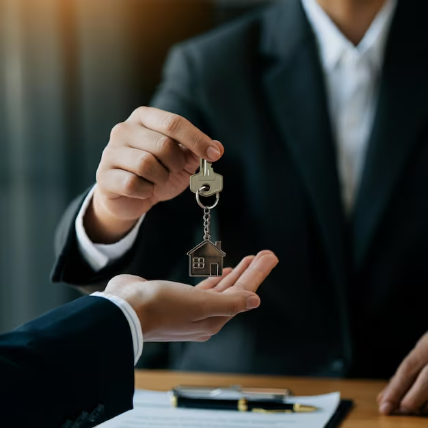Handing over house keys in a legal context, symbolizing tenant rights and landlord-tenant agreements in Schertz, Texas.